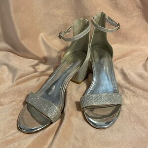 Glittery, silver shoes with a chunky heel, and straps. Size 7 1/2, worn once